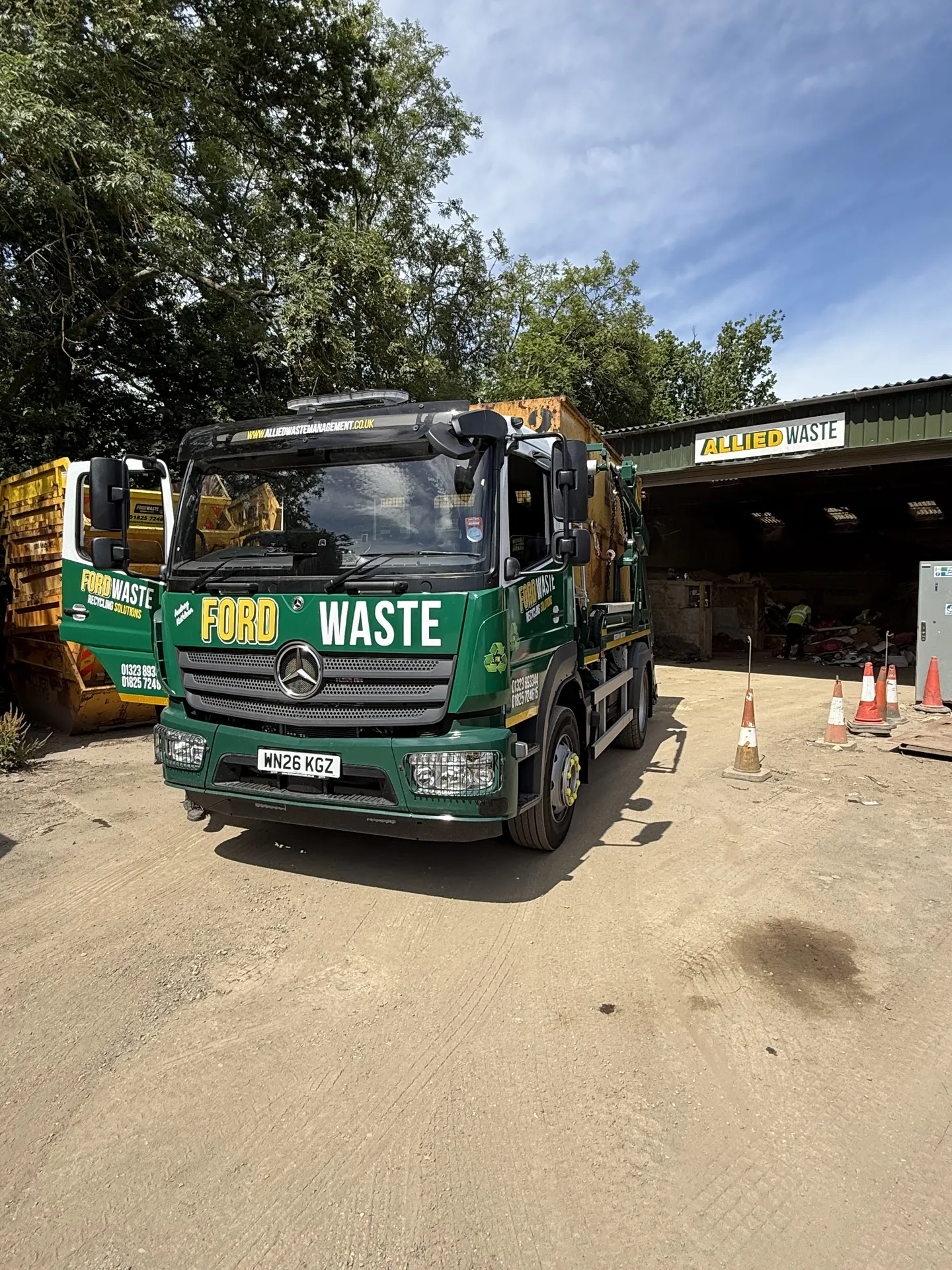 A Ford Waste skip lorry ready to leave the yard — wait and load service